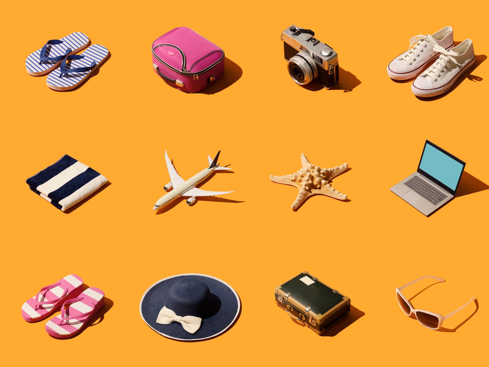 A grid of summer holiday objects — sandals, a suitcase, a camera, a sun hat — on a plain orange ground.